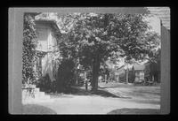 Back steps in foreground of Colby Block; Steven's House porch seen