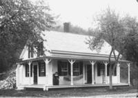 Woman on the front porch of a house, Williamsville, Vt.