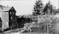 Building next to a stream and dam