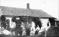 Family portrait in front of a house