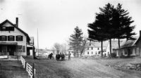 Village view with team of oxen on road