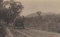 Automobile on dirt road