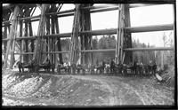 Men with horses and wagons at the bottom of the Pumpkin Hill Bridge in                        Danville, Vermont