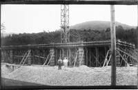 Two men pictured in front of Pumpkin Hill bridge in Danville,                        Vermont