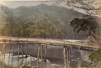 Bridge spanning a large river in rural Japan