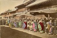 People lined up to view a parade or procession