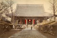 Temple walkway lined with stalls and vendors