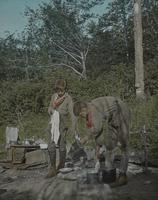 Ward Olney and Leverett Smith washing dishes at Carmel Camp