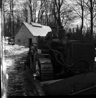 Fred Taylor on tractor in front of sugar house