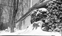 Woodpile, used to fuel the evaporator, outside sugar                             house