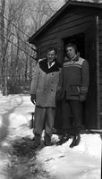 Al Winston and son outside research shed