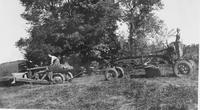 Men hauling farm equipment