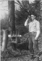 Worker surveying near experiment station